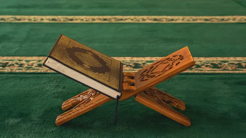 Digital prayer time display screen showing Fajr, Dhuhr, and Isha schedule