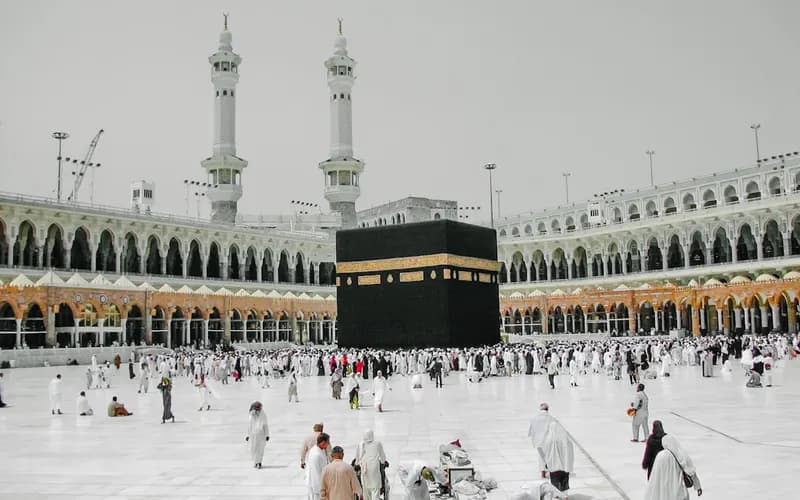 Muslim pilgrims performing tawaf, circling the Kaaba together during their Umrah pilgrimage