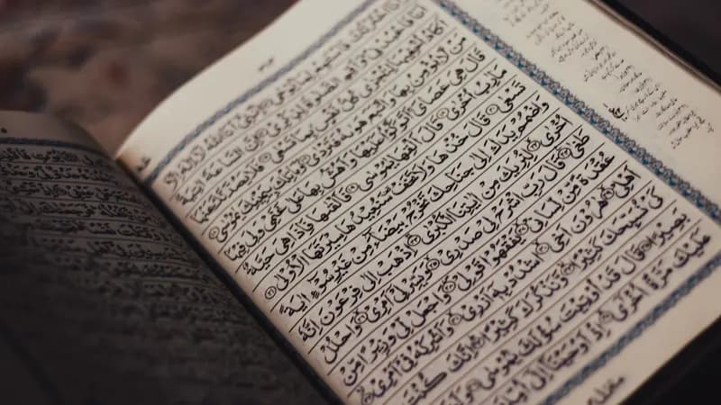 Muslim family reading Quran together preparing for the blessed month of Ramadan