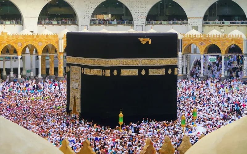 Pilgrims performing tawaf while circling around the Kaaba during Hajj or Umrah