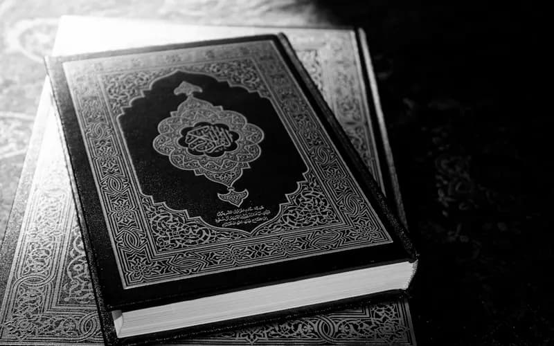 Open Quran page symbolizing the declaration of faith and belief in Islam