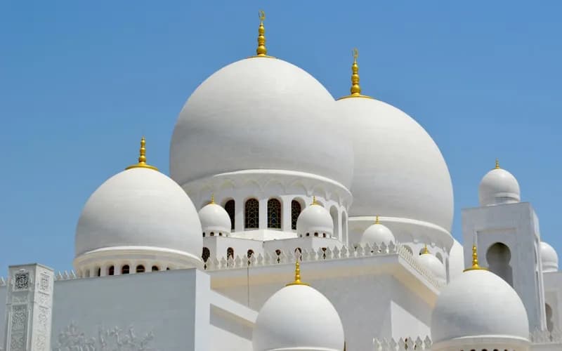 Islamic architecture with intricate calligraphy reflecting the spiritual weight of Quranic verses